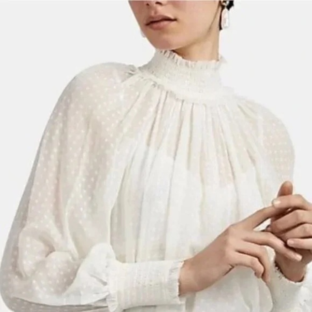 Zimmermann Botanica swiss dot silk blend blouse featuring a high smocked neck